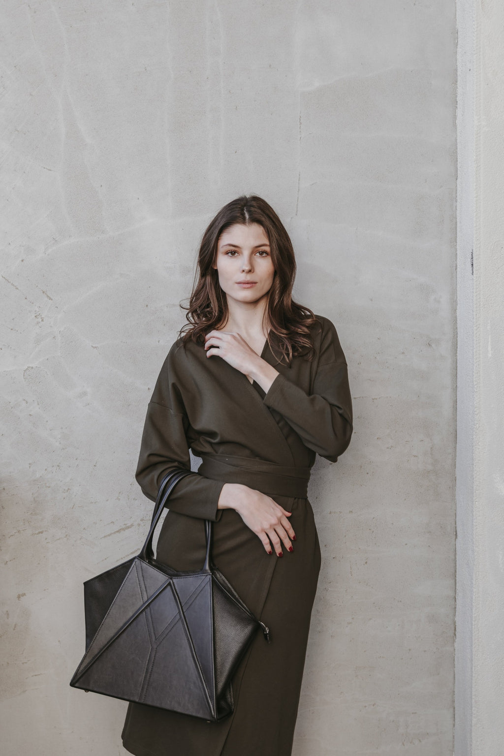 elegant gerda retter leather tote bag with magnetic closure in soft morning light