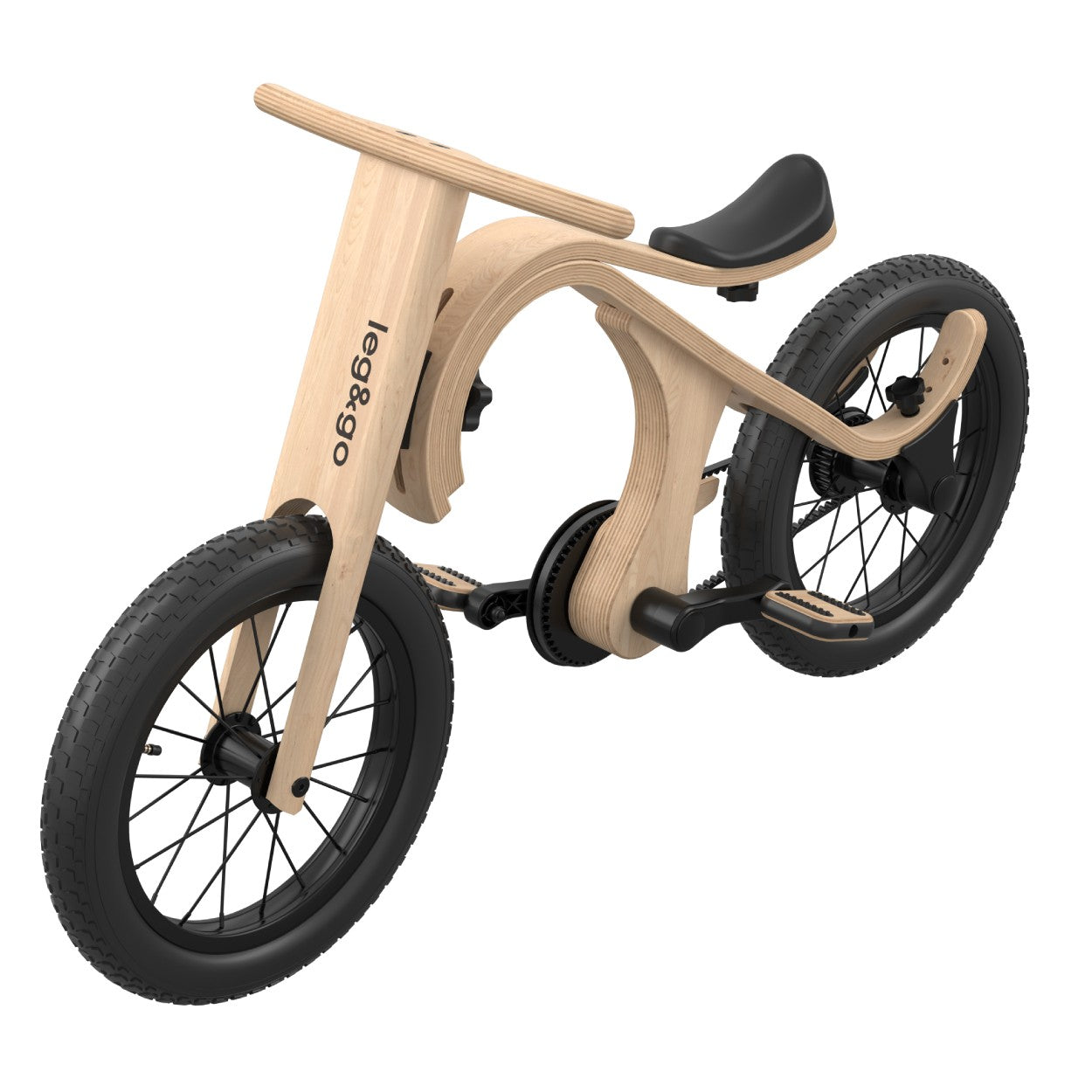 a child's hand gently resting on the wooden pedal of their converted balance bike
