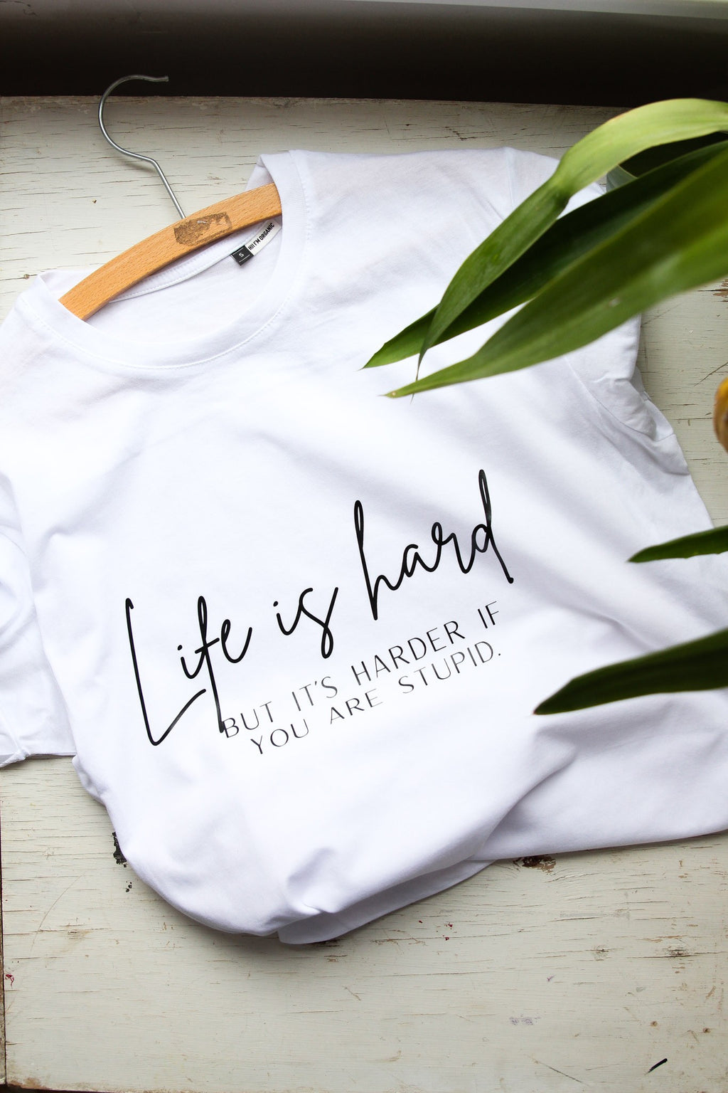 bold close-up of the life is hard t-shirt text on soft organic cotton