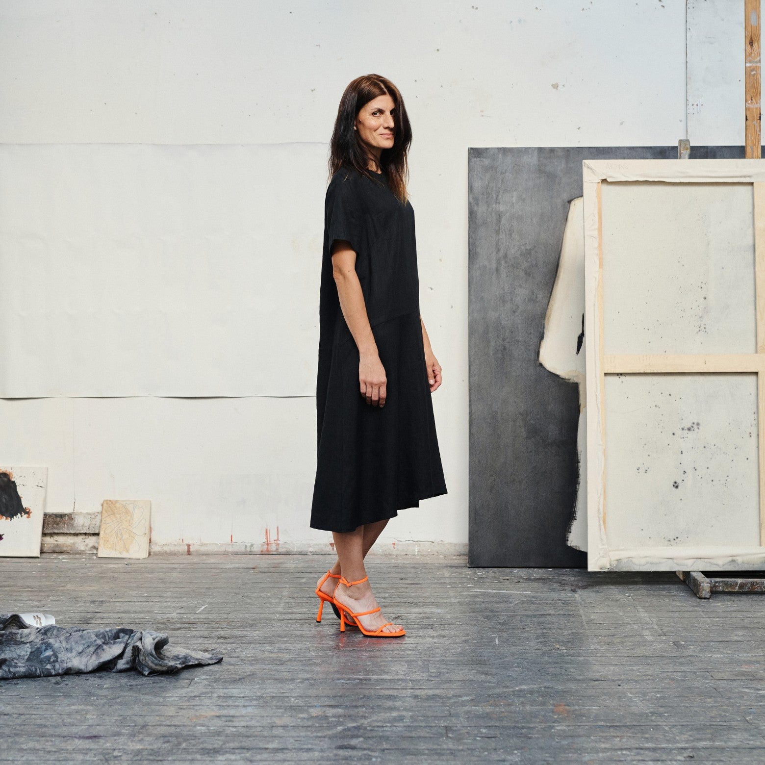 soft black linen dress with a-line silhouette in gentle morning light