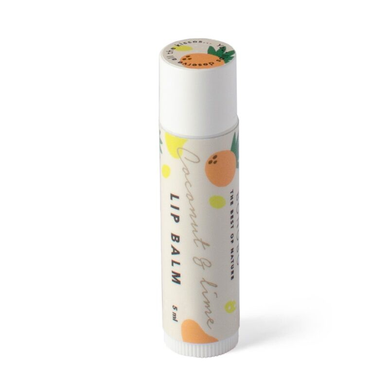 bold close-up of coconut and lime lip balm with sharp focus and dramatic studio lighting