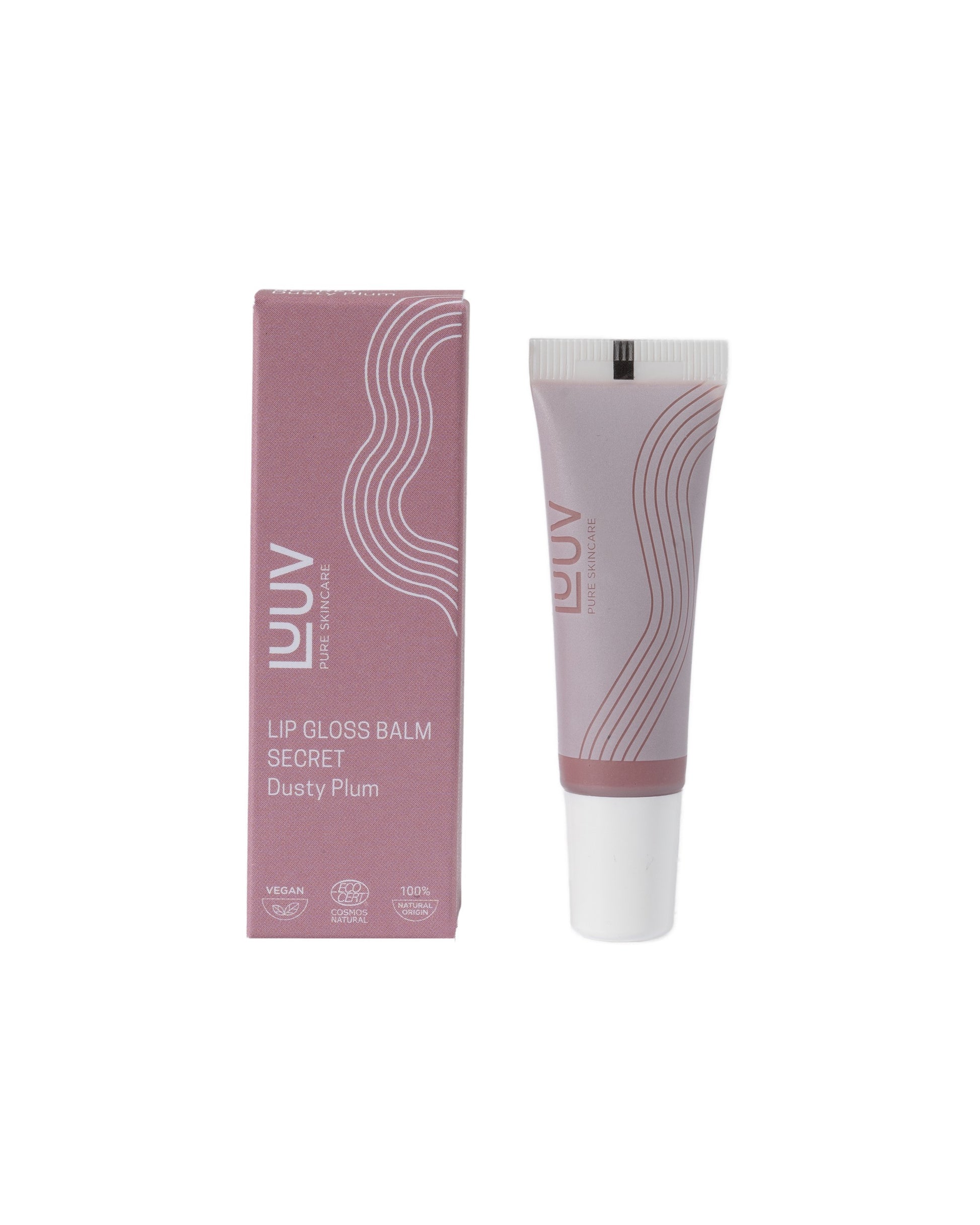 luuv secret gloss balm held in hand with soft morning light highlighting its gentle shine