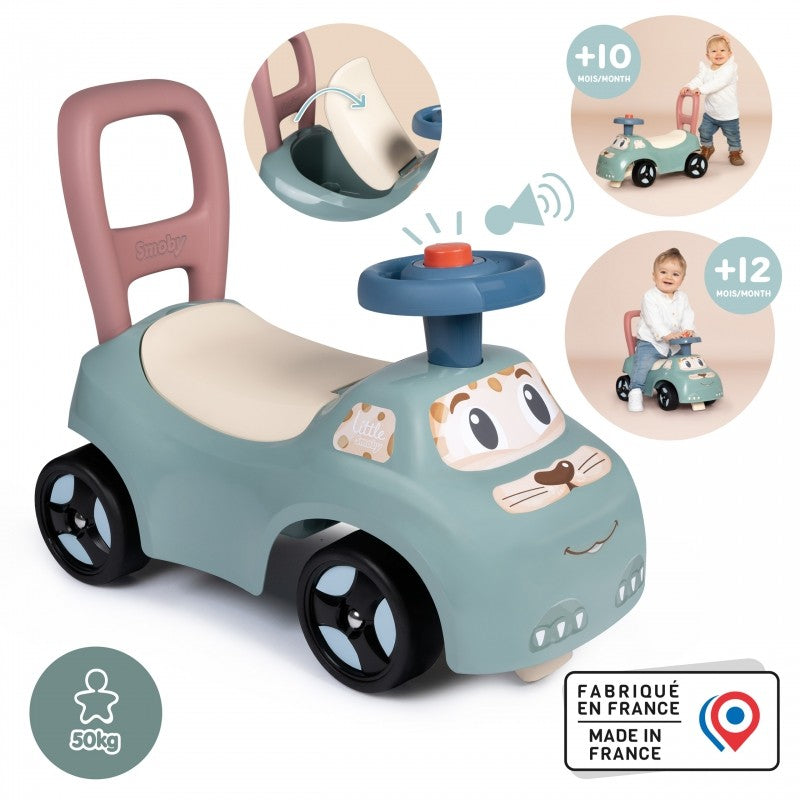 pastel ride-on pusher with horn, perfect for toddlers learning to walk, in a sunny outdoor setting
