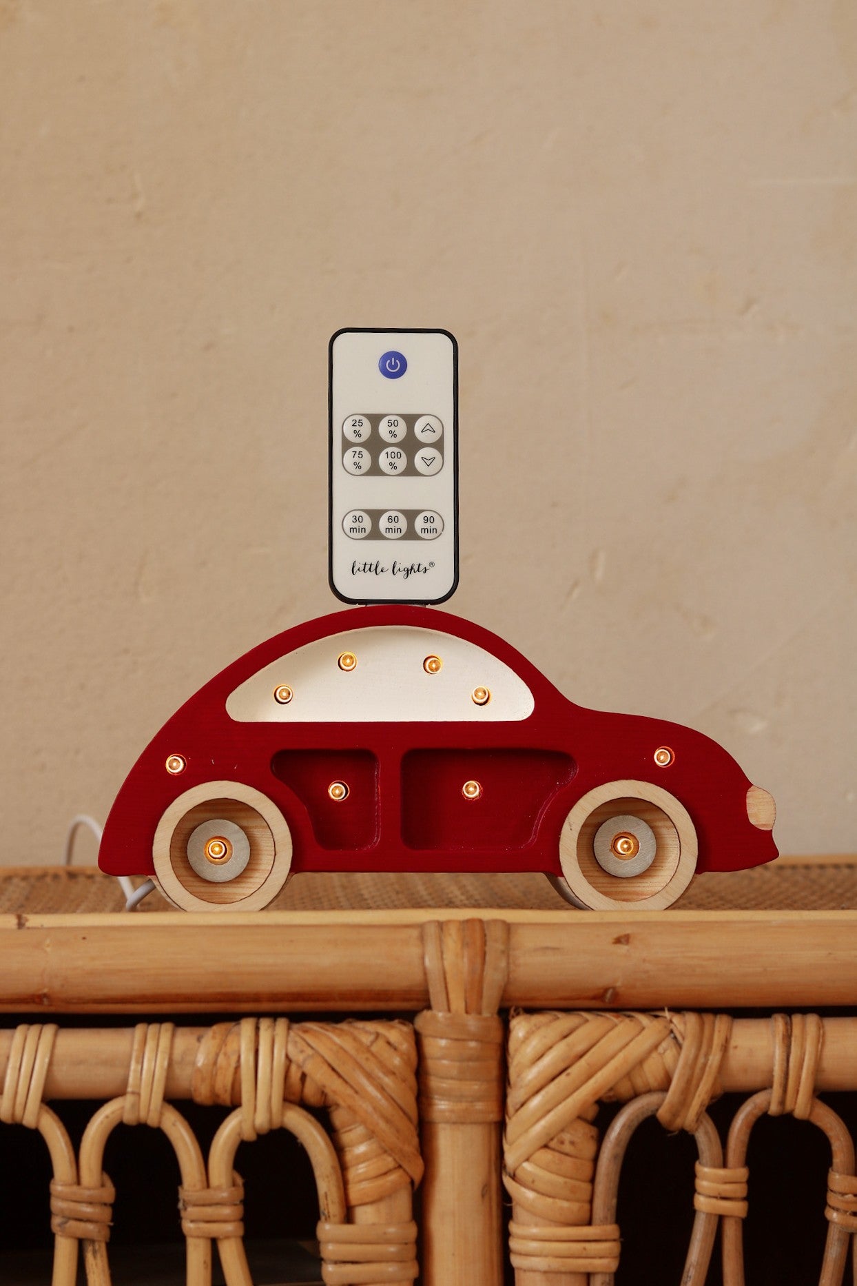 close-up of the beetle car lamp's pine wood grain and adjustable dimmer switch in a child's room