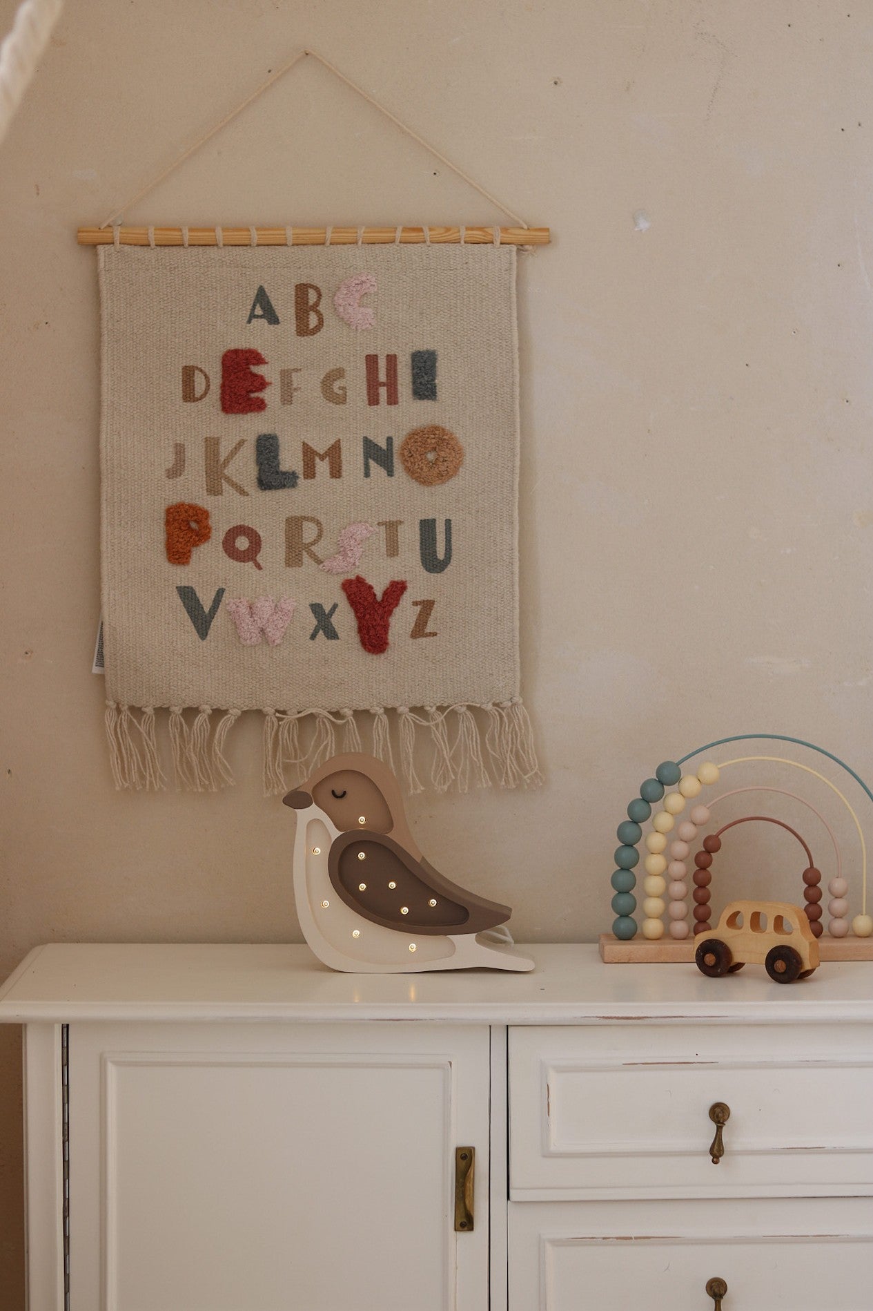 elegant little lights bird mini lamp casting a warm, refined glow on a nightstand