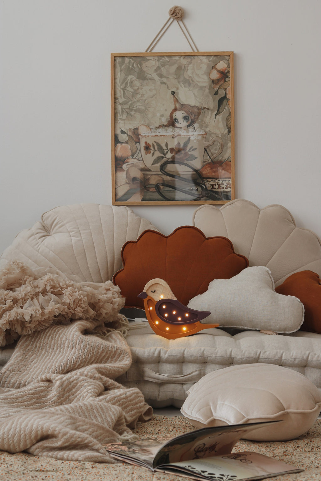 handmade pine wood bird lamp casting a soft glow on a nursery shelf at dusk