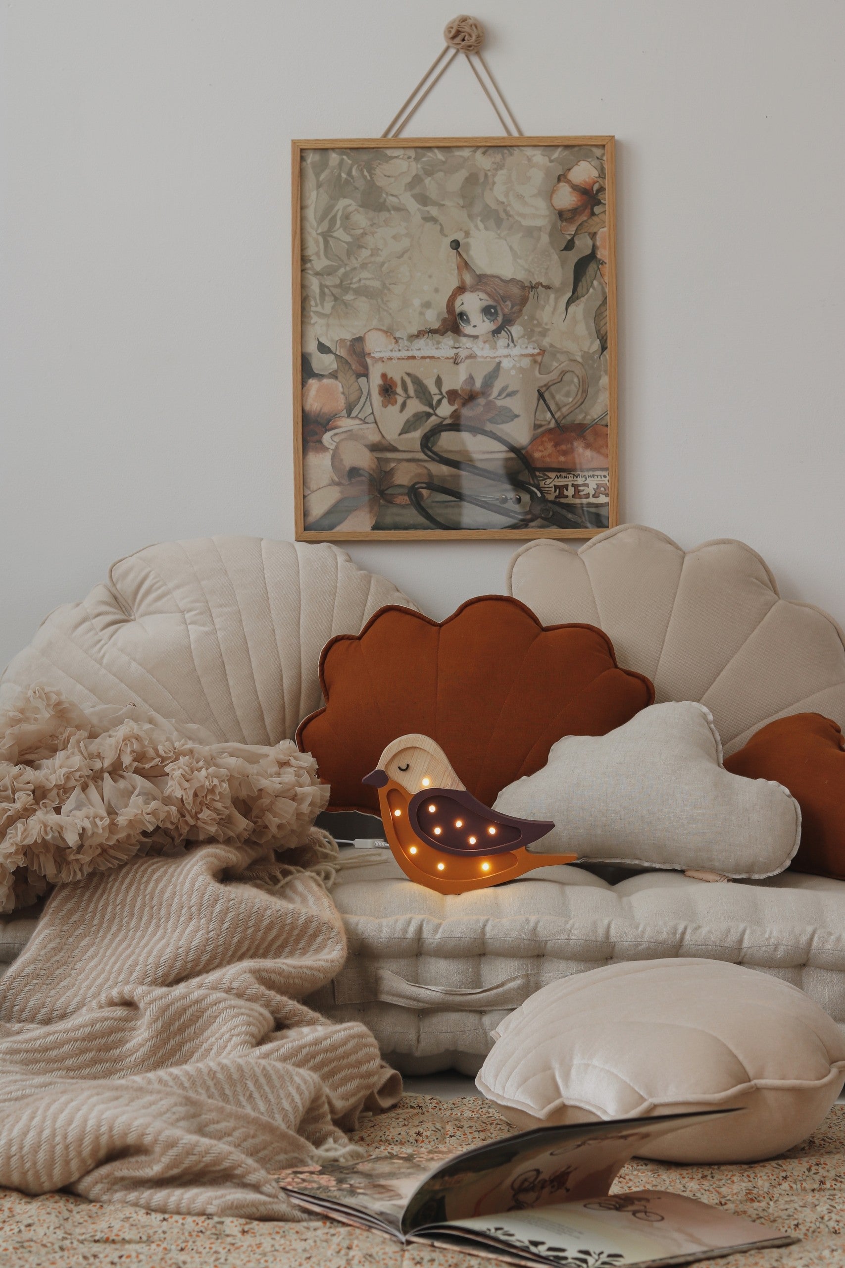 handmade pine wood bird lamp casting a soft glow on a nursery shelf at dusk