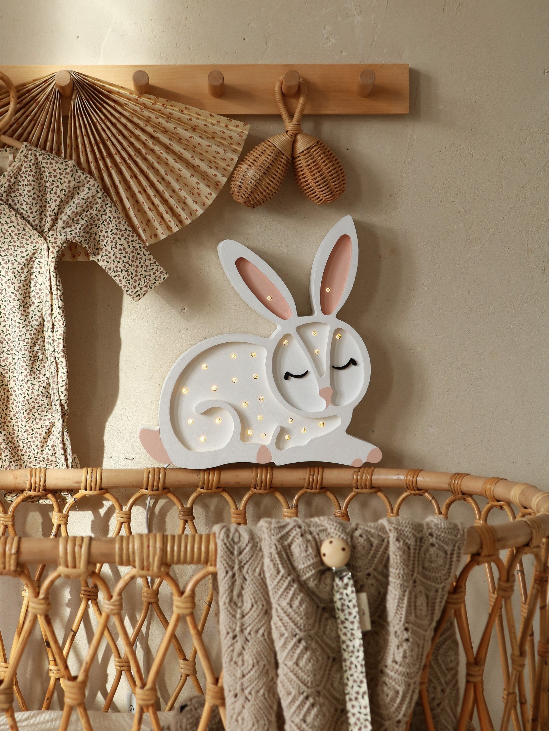 handcrafted pine wood cat lamp casting a warm glow on a nursery shelf