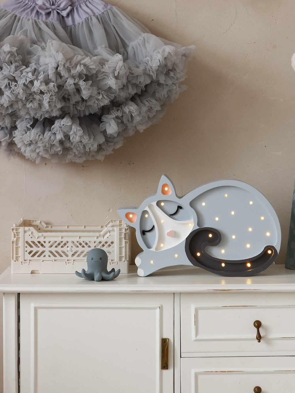 handcrafted pine wood cat lamp casting a soft, warm glow in a cozy nursery corner