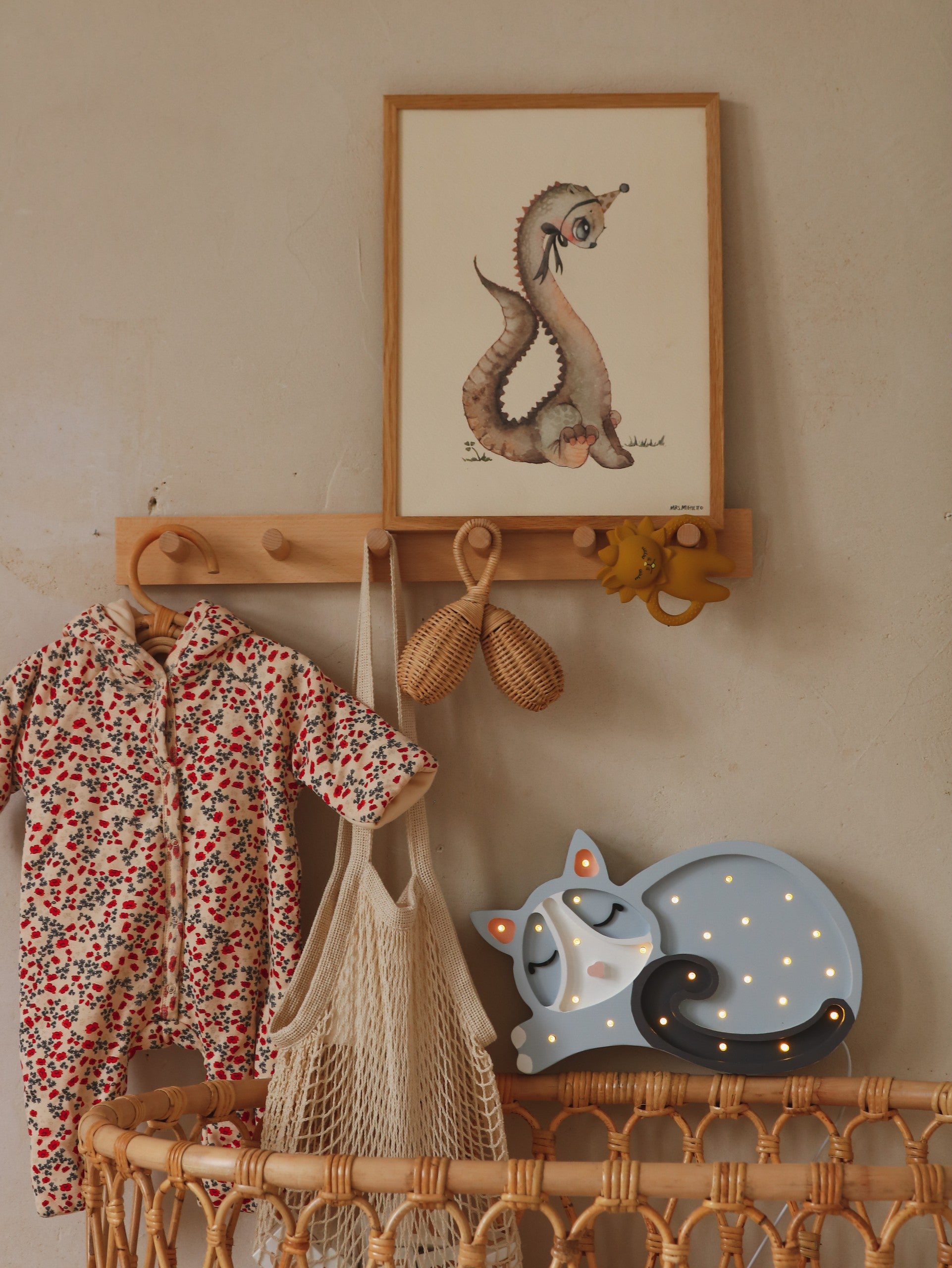 handcrafted pine wood cat lamp casting a warm glow on a childs bedside table