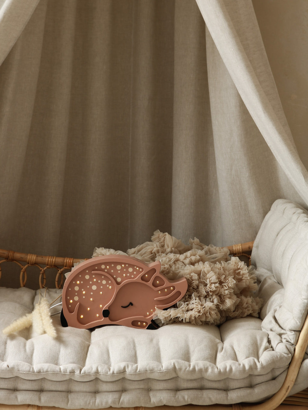 practical close-up of the little lights deer lamp's built-in dimmer and timer controls on its solid pinewood base