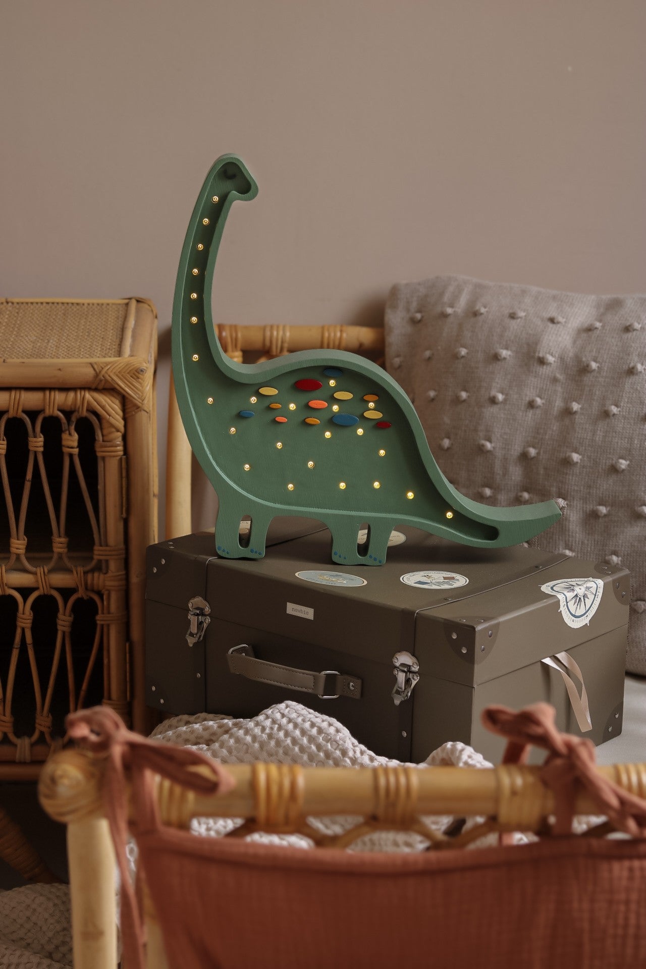 playful diplodocus lamp casting a fun glow on a childs bedside table