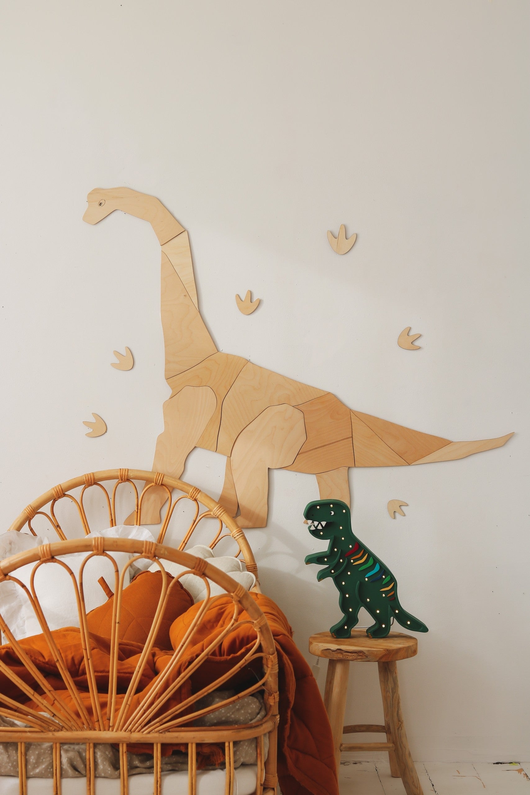 playful t-rex lamp glowing warmly on a childs nightstand during storytime