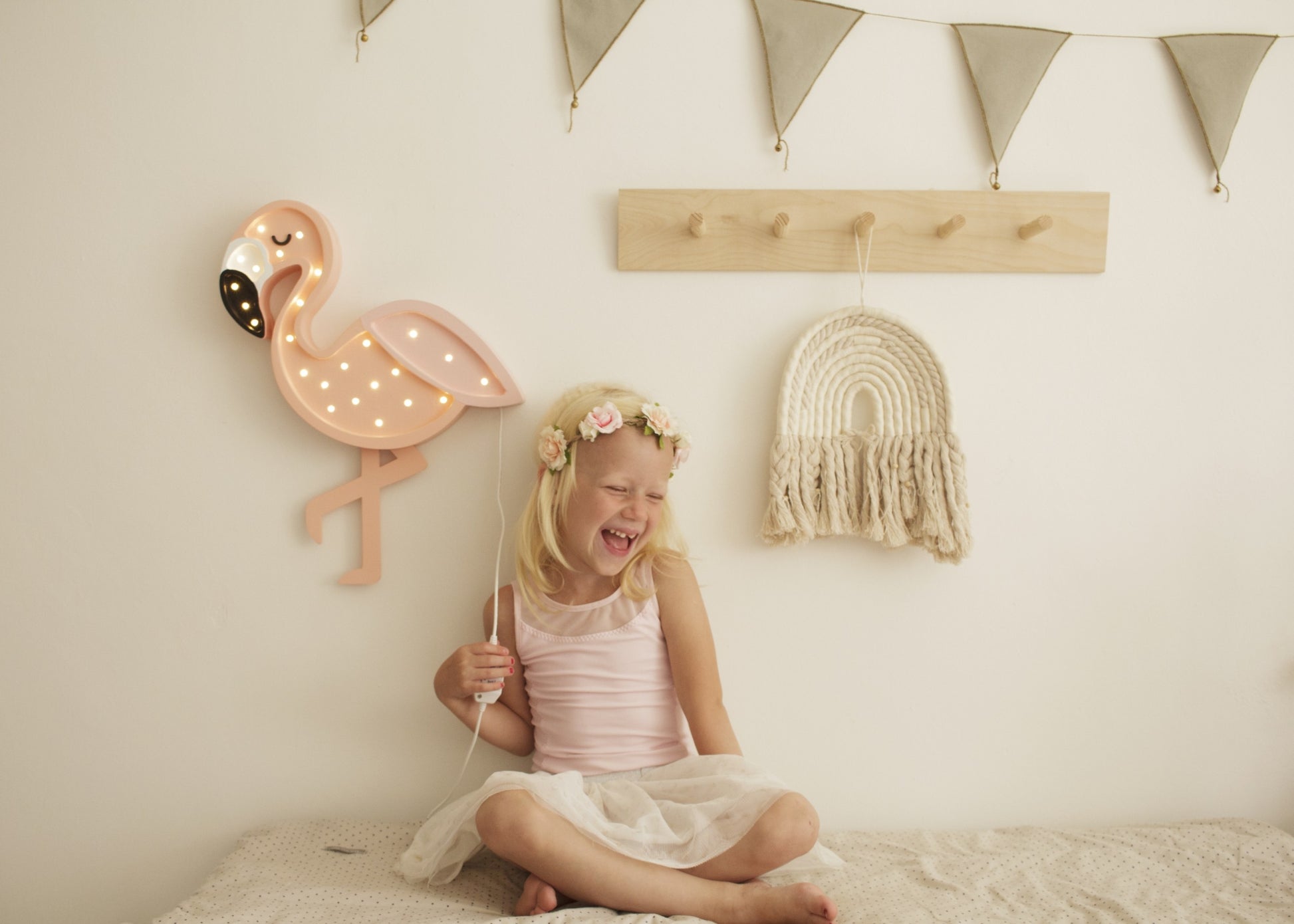 playful pink flamingo night light casting a fun glow on a childs bedside table