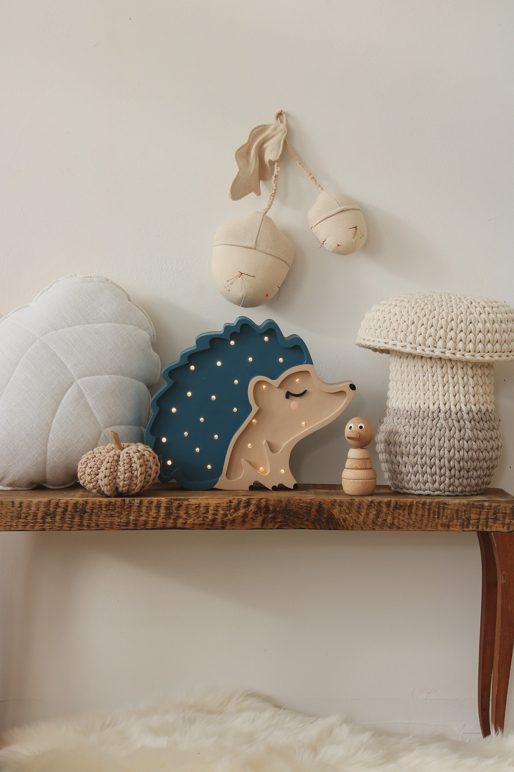 playful hedgehog night lamp casting a warm glow on a child's bedside table