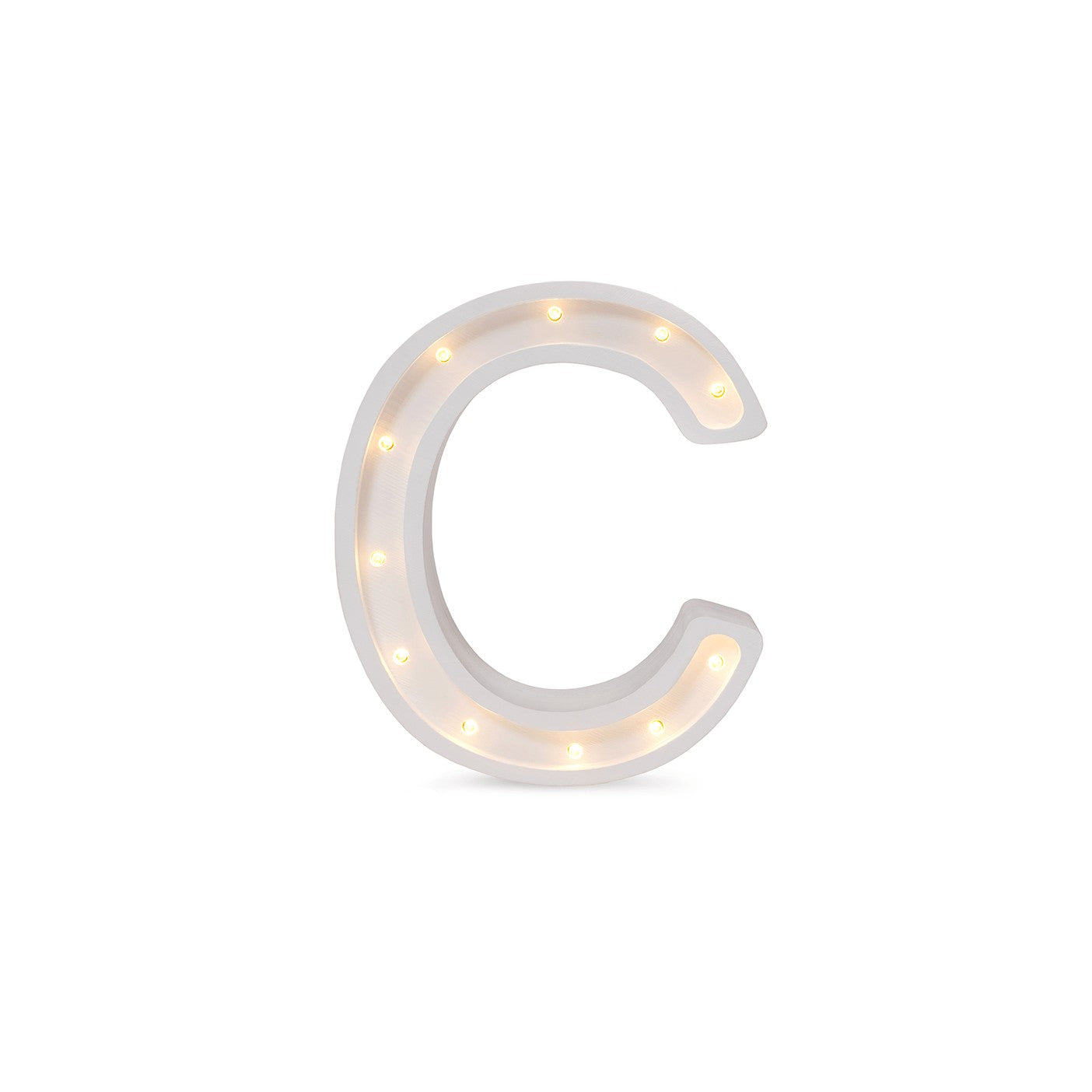 bold close-up of the handmade letter c lamp glowing warmly in a dark nursery