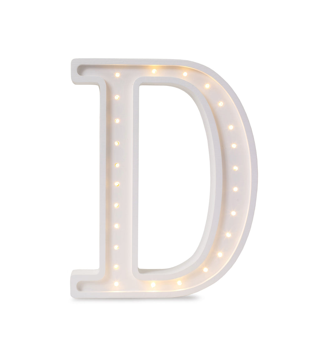 softly glowing letter d lamp casting a warm glow on a childs nightstand