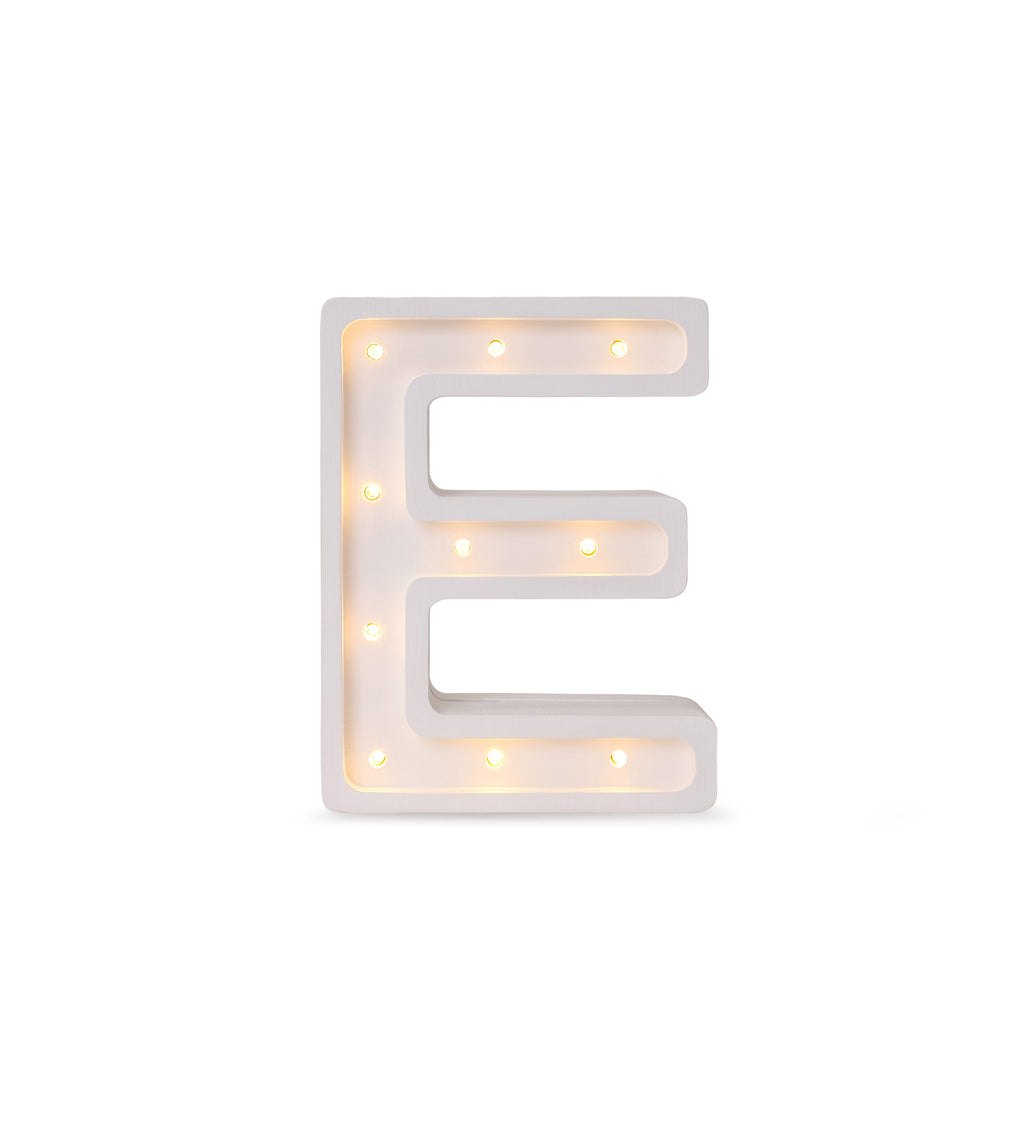 bold solid pinewood letter e lamp casting a warm glow in a child's room