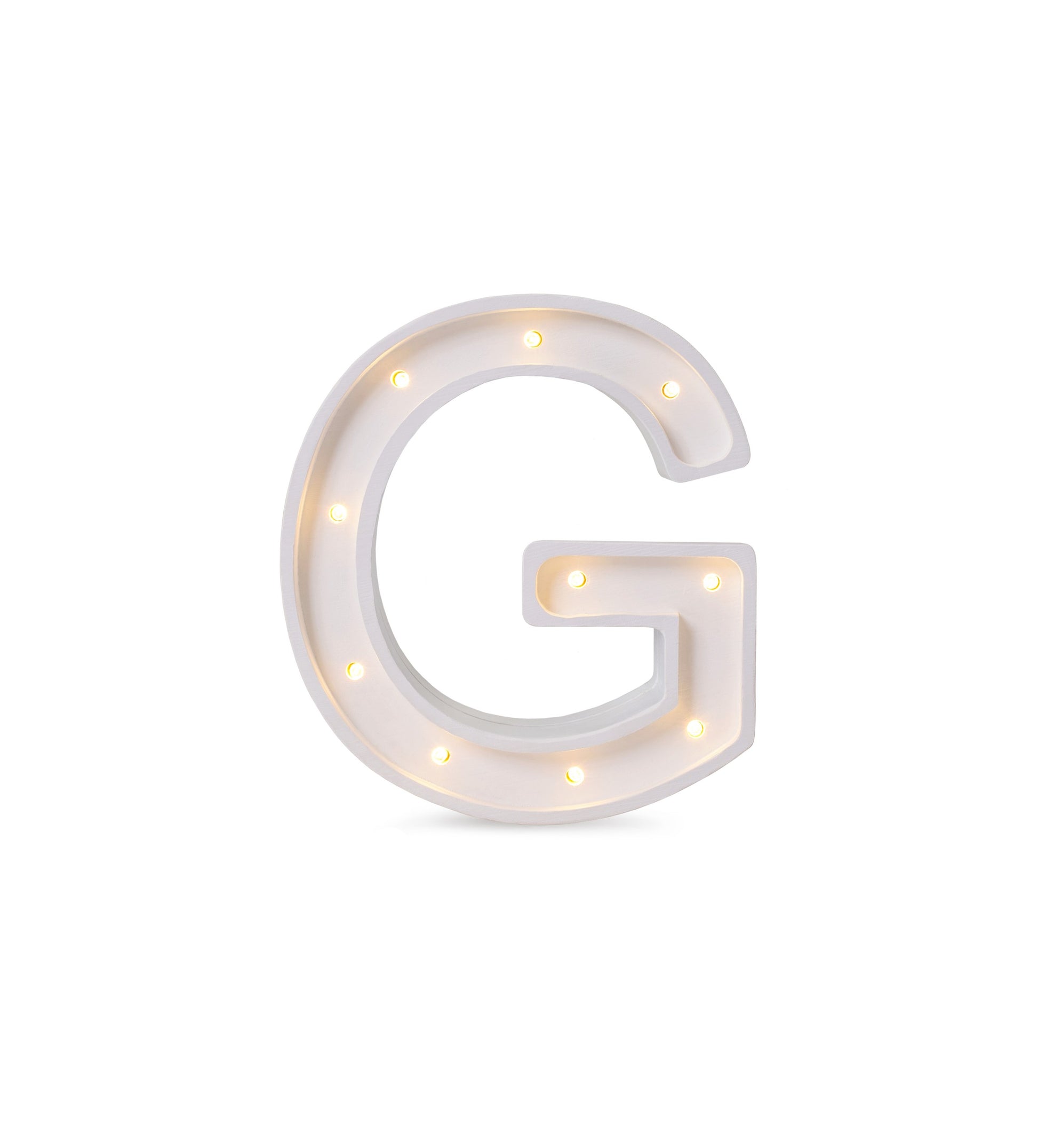 bold solid pinewood letter g lamp glowing warmly in a childs room at night