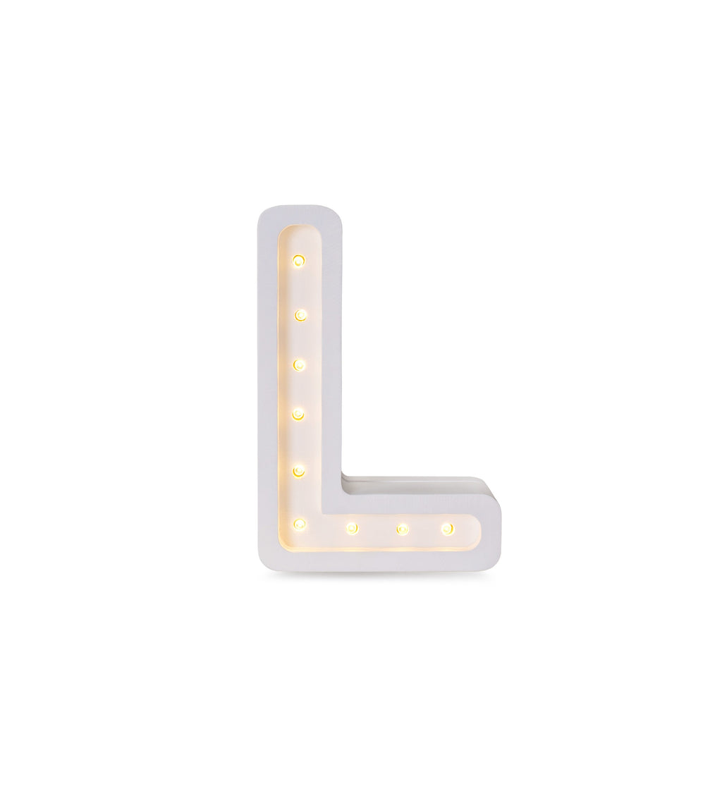 bold and confident large letter l lamp casting a warm glow in a modern nursery