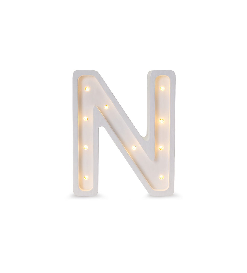 bold solid pinewood letter n lamp glowing confidently in a modern nursery