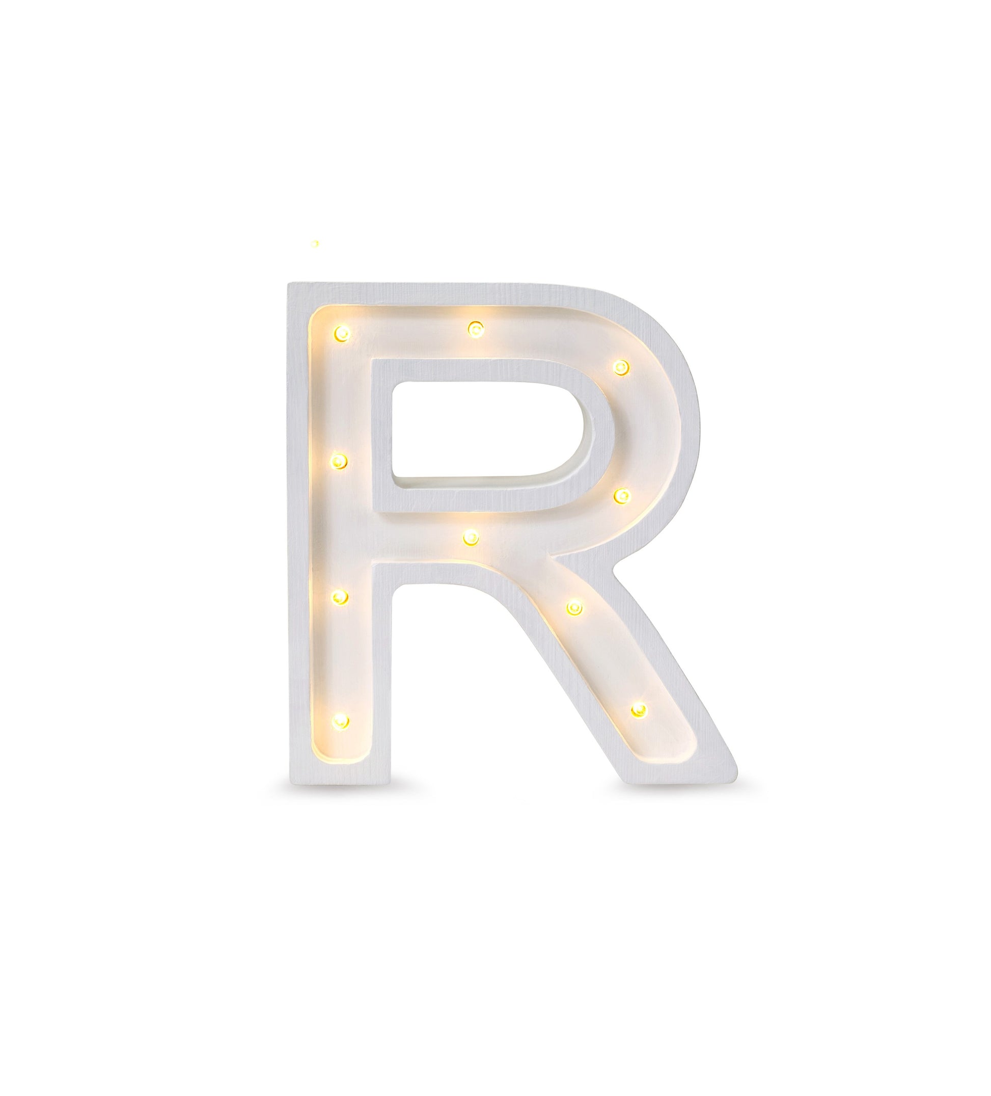 bold artisan-crafted letter r lamp glowing warmly in a modern nursery setting