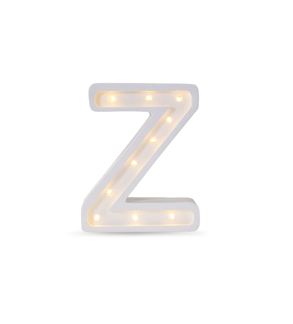 bold solid pinewood letter z lamp glowing warmly in a modern child's bedroom