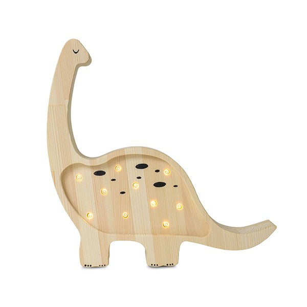 a child's hand turning the dimmer on a solid pinewood mini dino lamp at bedtime