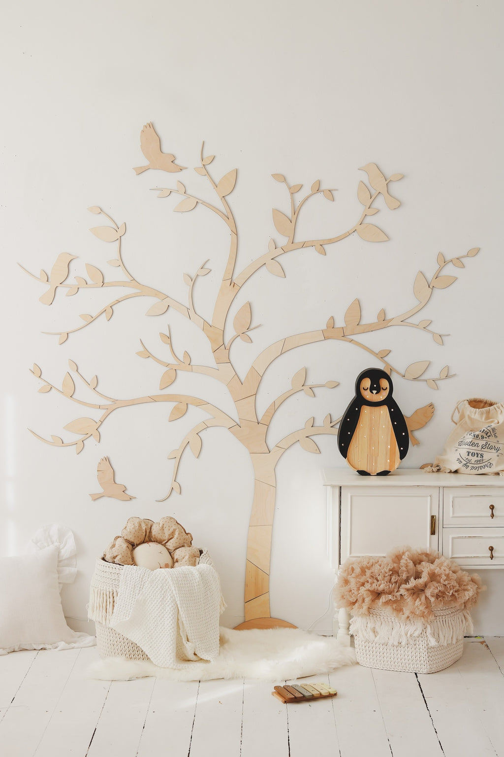 a soft-glow penguin night light casting a warm, comforting ambiance on a nursery shelf