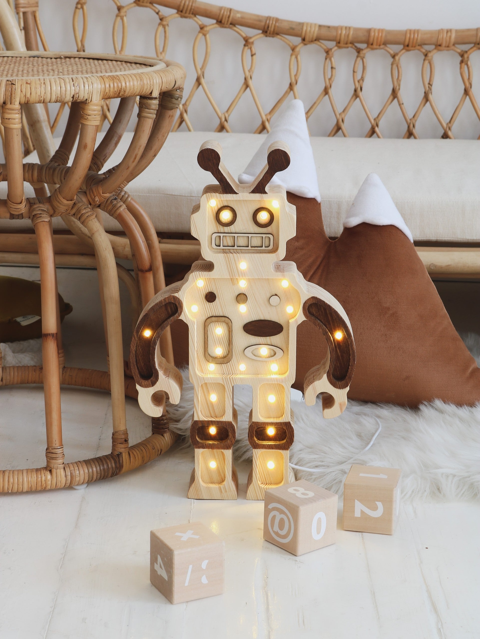 elegant pine wood robot lamp casting a soft, refined glow on a nightstand