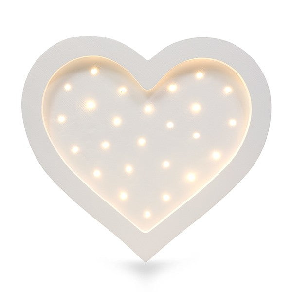 playful heart lamp casting a warm glow on a child's bedside table during story time