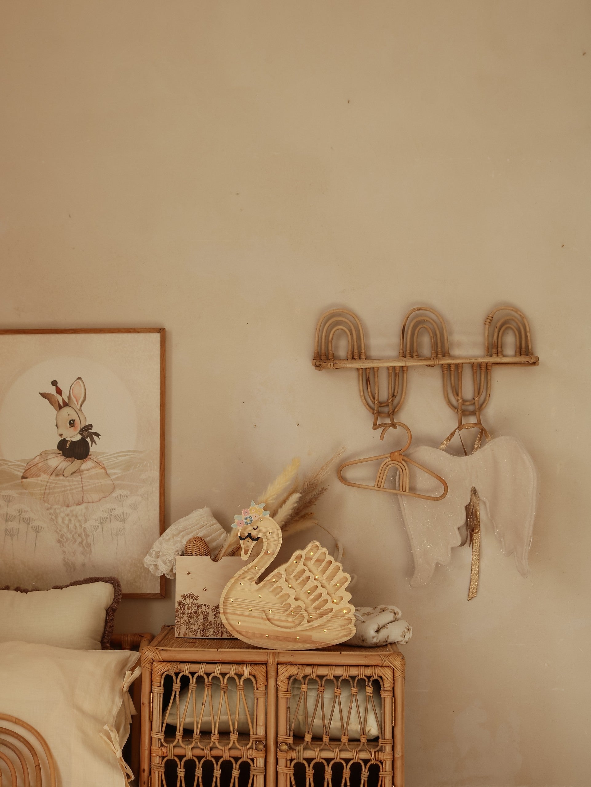 elegant swan lamp casting a warm glow on a wooden nightstand