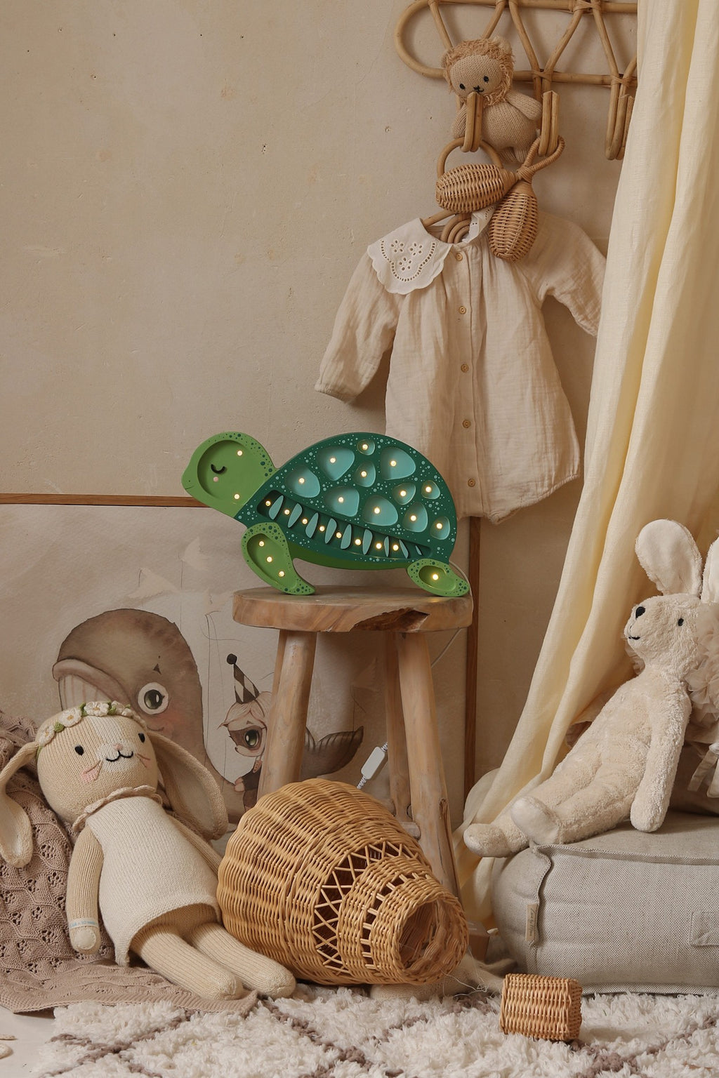 playful turtle night light casting a warm glow on a childs wooden toy