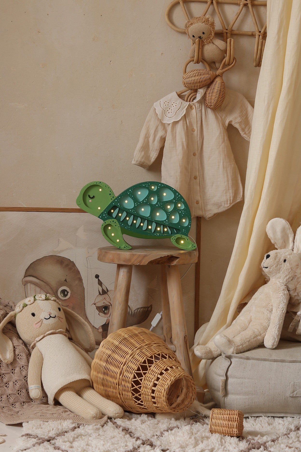 playful turtle night light casting a warm glow on a childs wooden toy