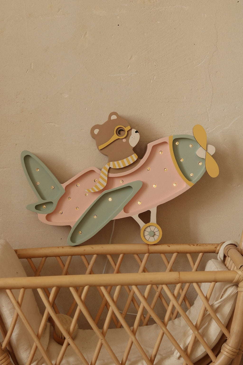 bold vintage aircraft lamp in dramatic low-angle shot highlighting its solid pinewood construction and warm led glow