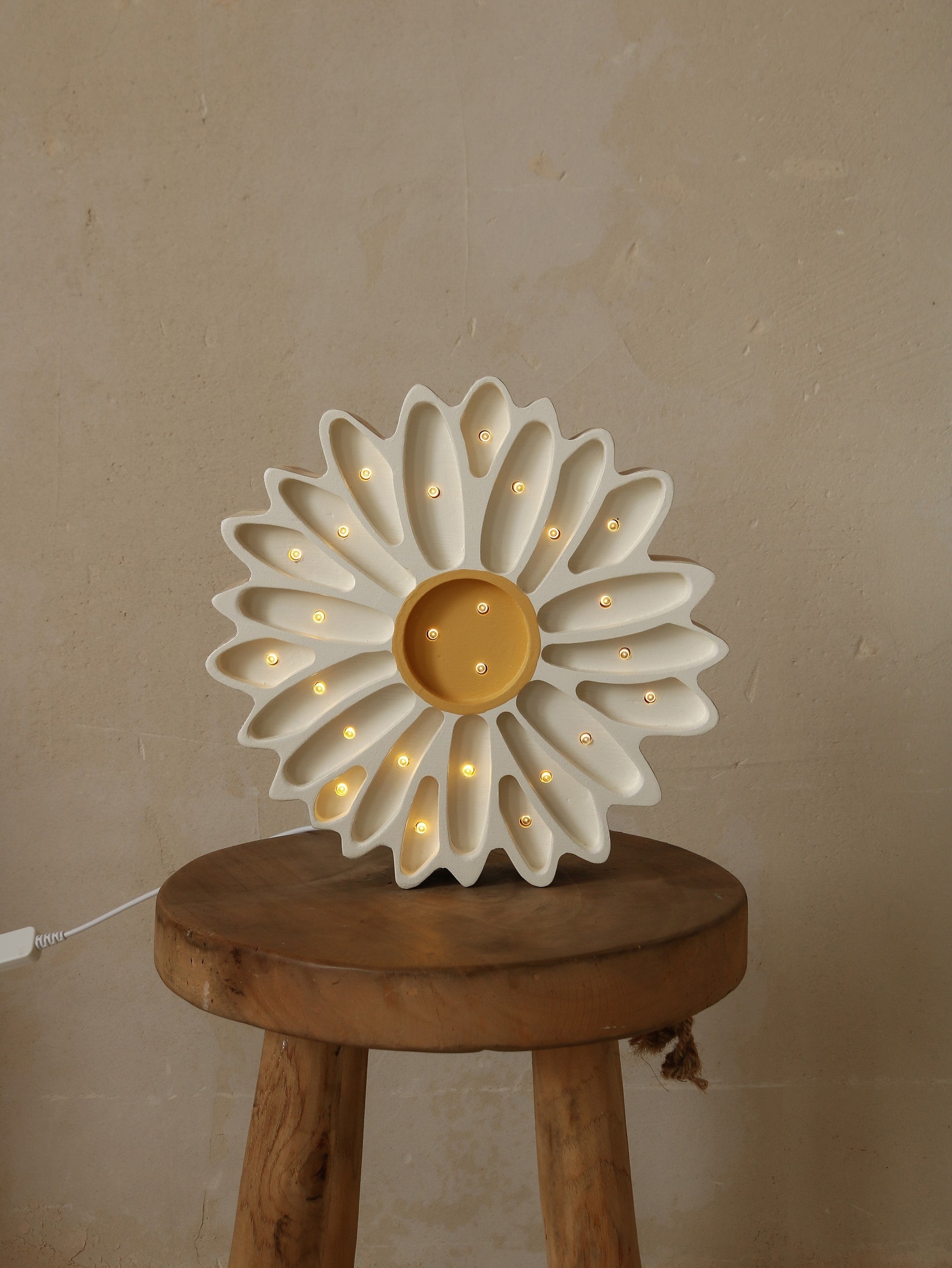 handcrafted daisy night light casting a warm glow on a childs bedside table