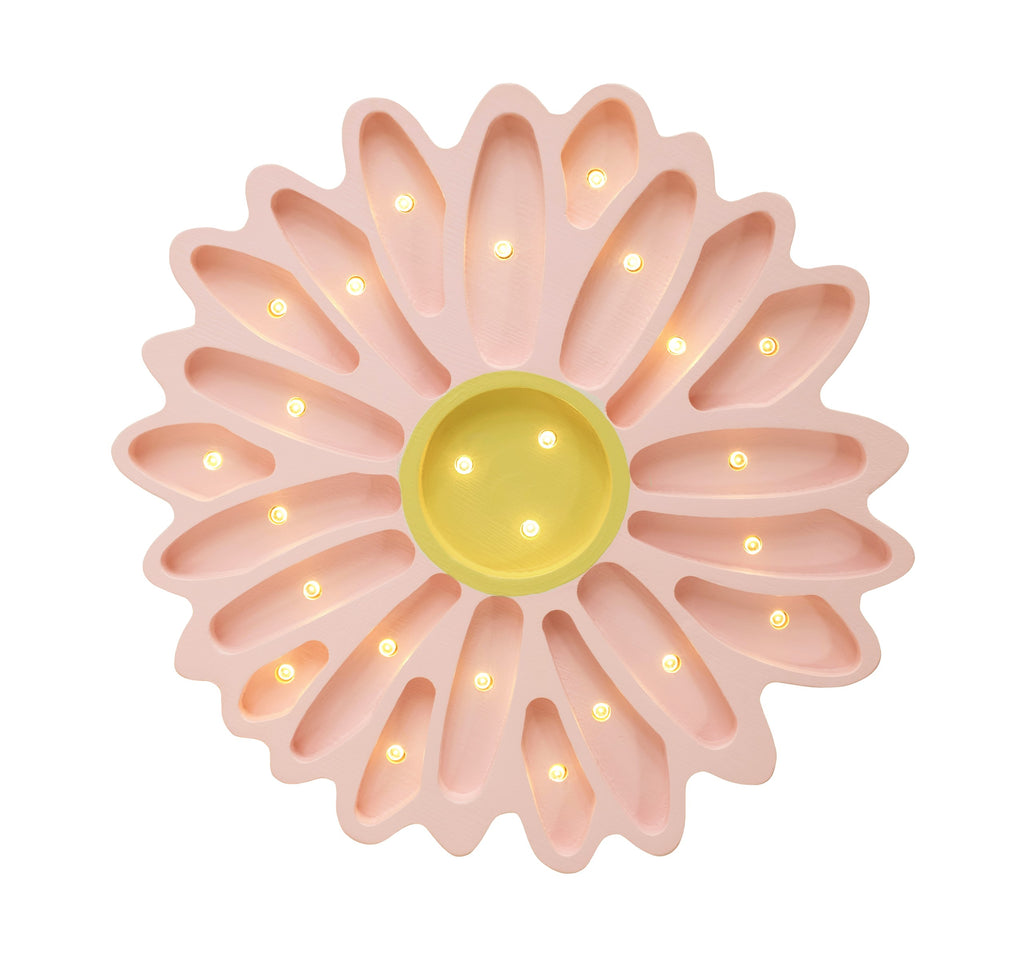 a daisy lamp casting a soft, warm glow on a wooden nightstand in a cozy nursery