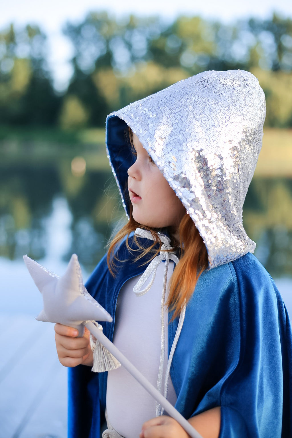 bold snow queen magic cape in dramatic blue velour with a deep hood