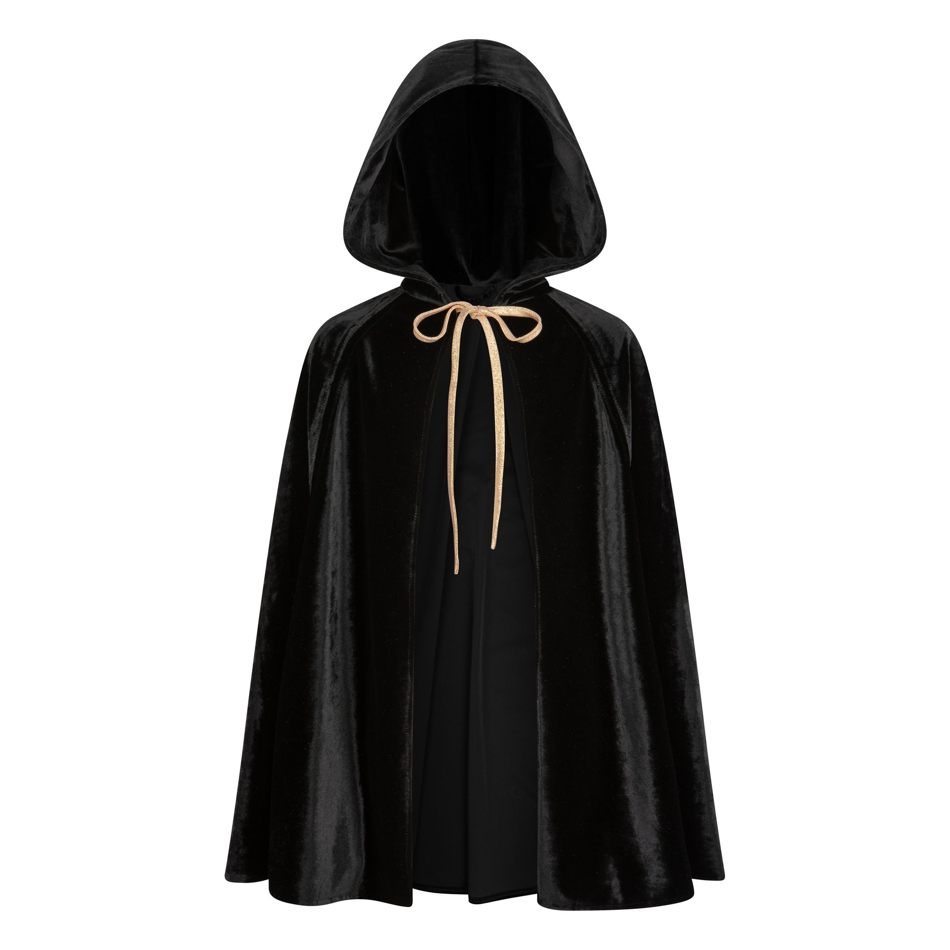 a child twirling in a playful black velour cape with hand holes, mid-spin during a fun backyard adventure