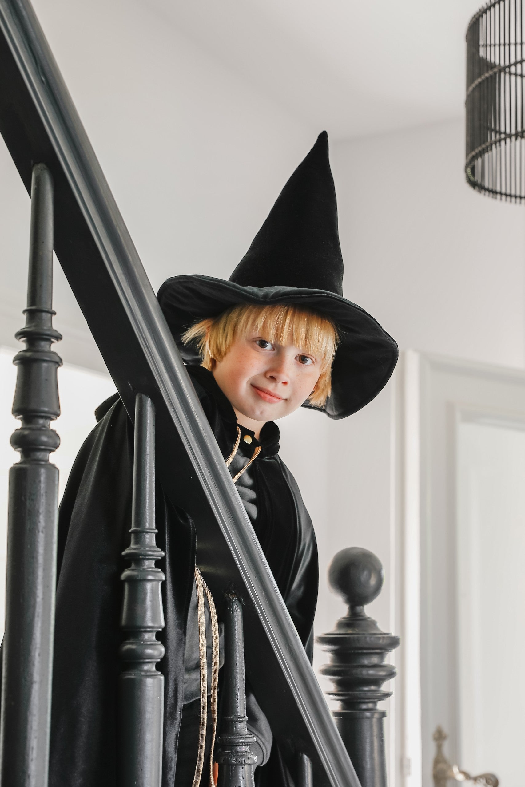 handmade black velour cape for kids with a deep hood and snap fastening