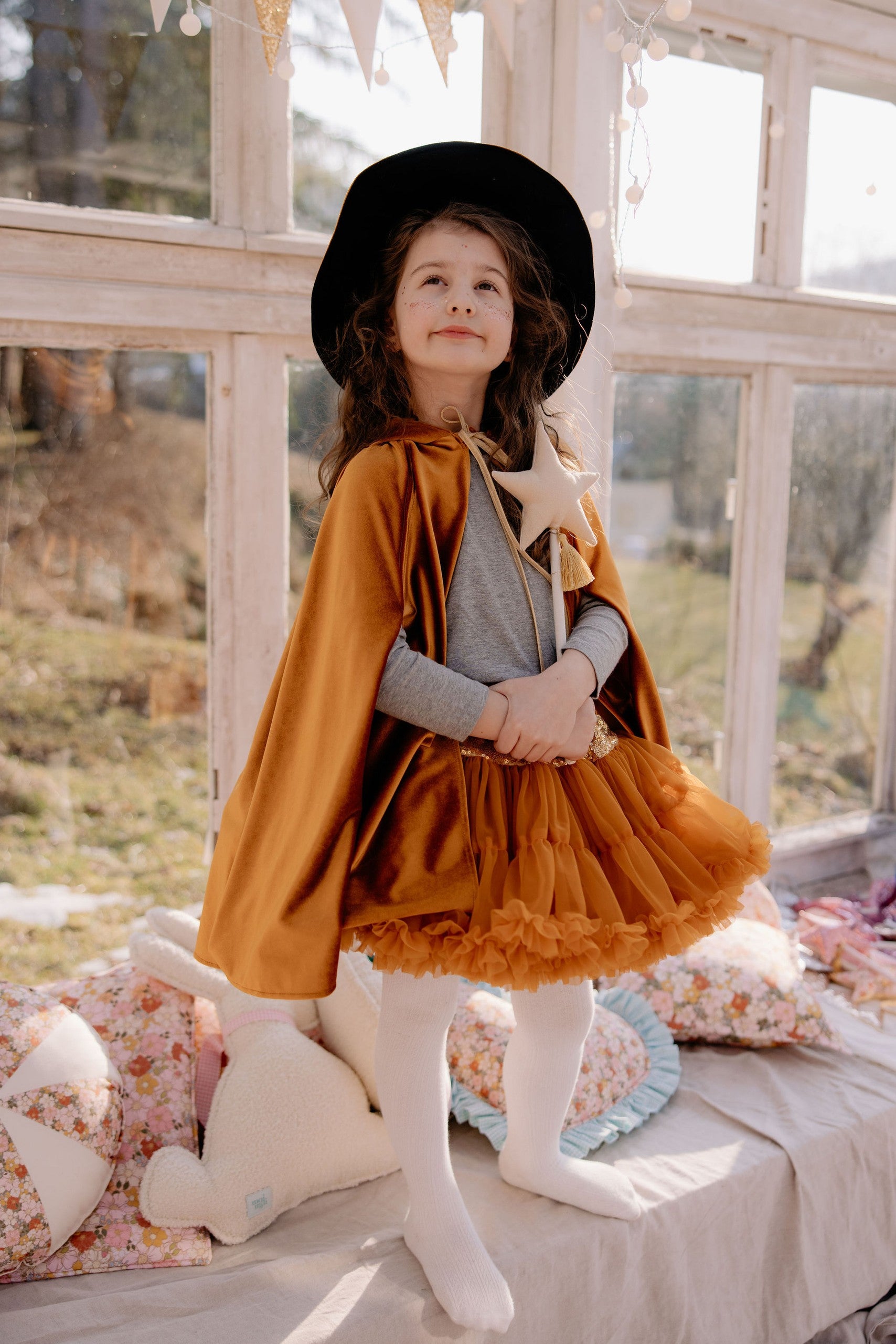 handmade golden velour kids cape with a deep hood and secure snap closure for adventurous play