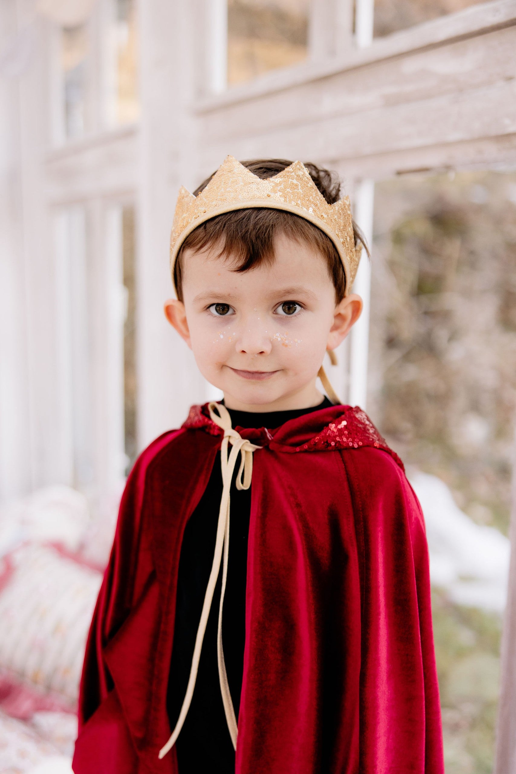 elegant red velour magic cape with a deep hood, hand holes, and snap fastening for fairy tale adventures