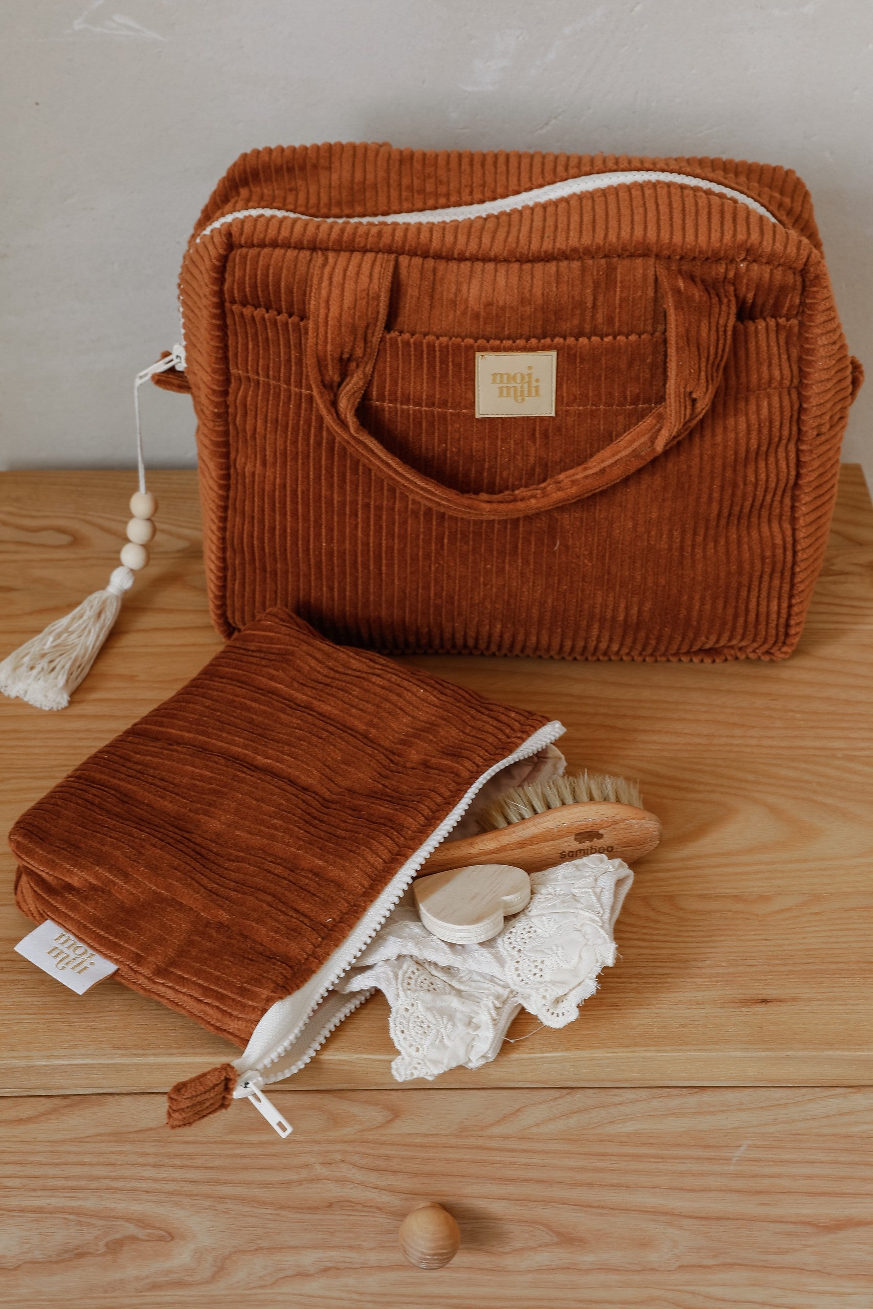 moi mili caramel makeup bag set of two on a rustic wooden table