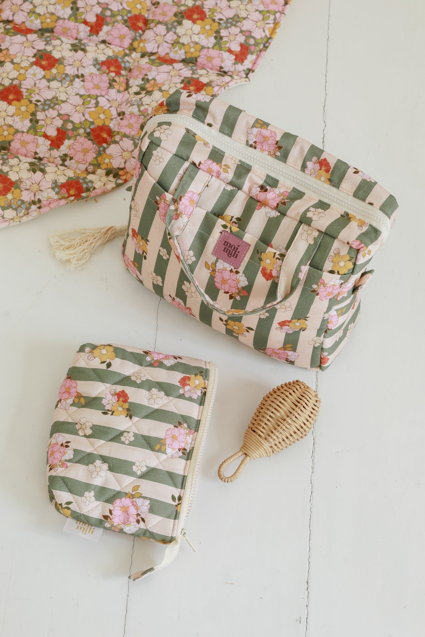 elegant green striped cotton makeup bag set of two, open to reveal its waterproof lining and pockets