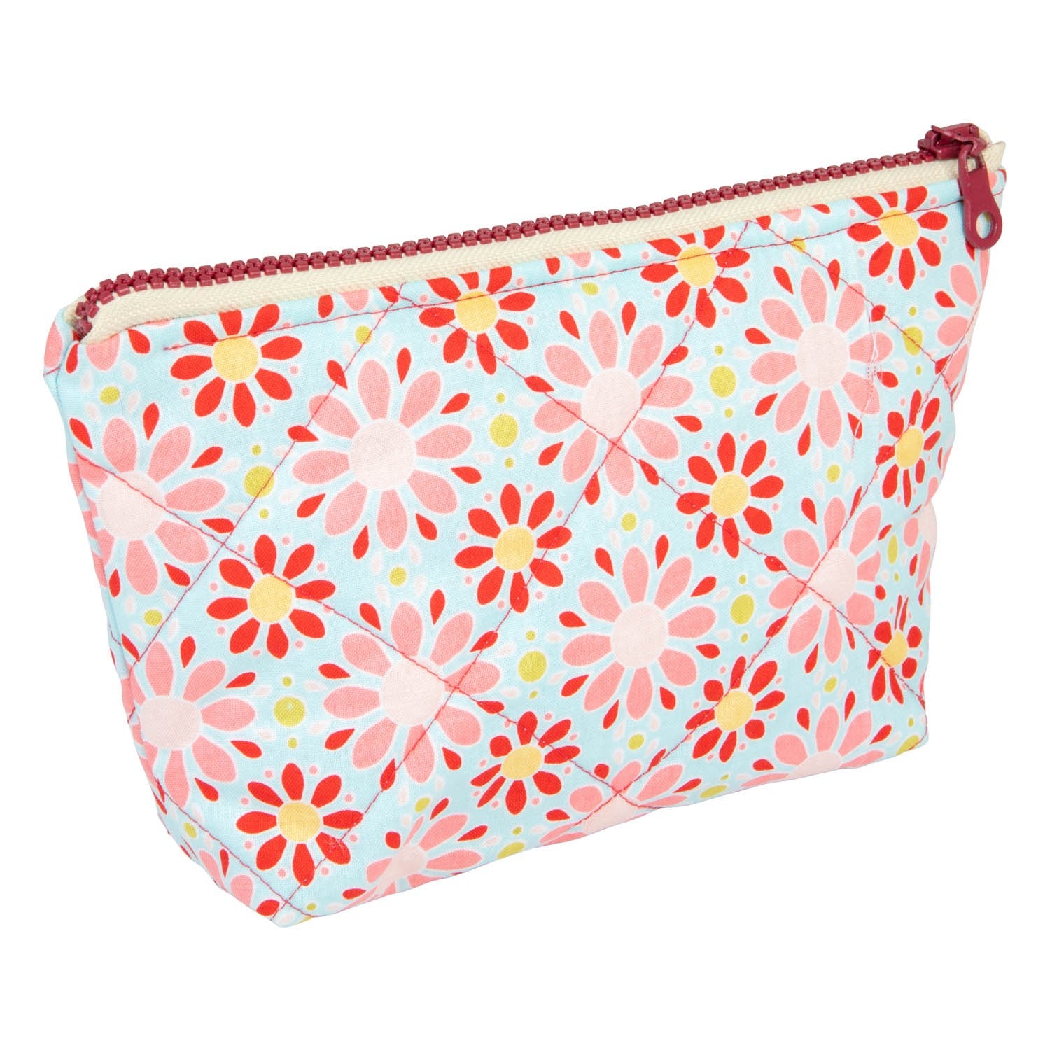 functional red floral makeup bag set open on a table showing its waterproof lining and pockets