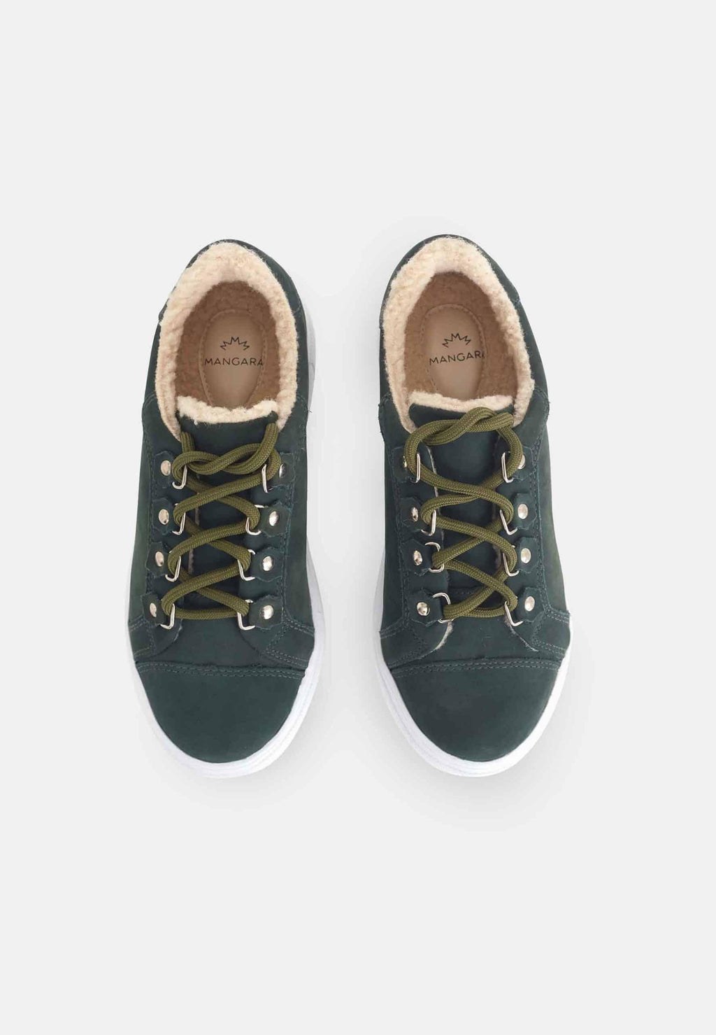 side view of soft green suede winter sneakers with a cozy lining, bathed in gentle morning light