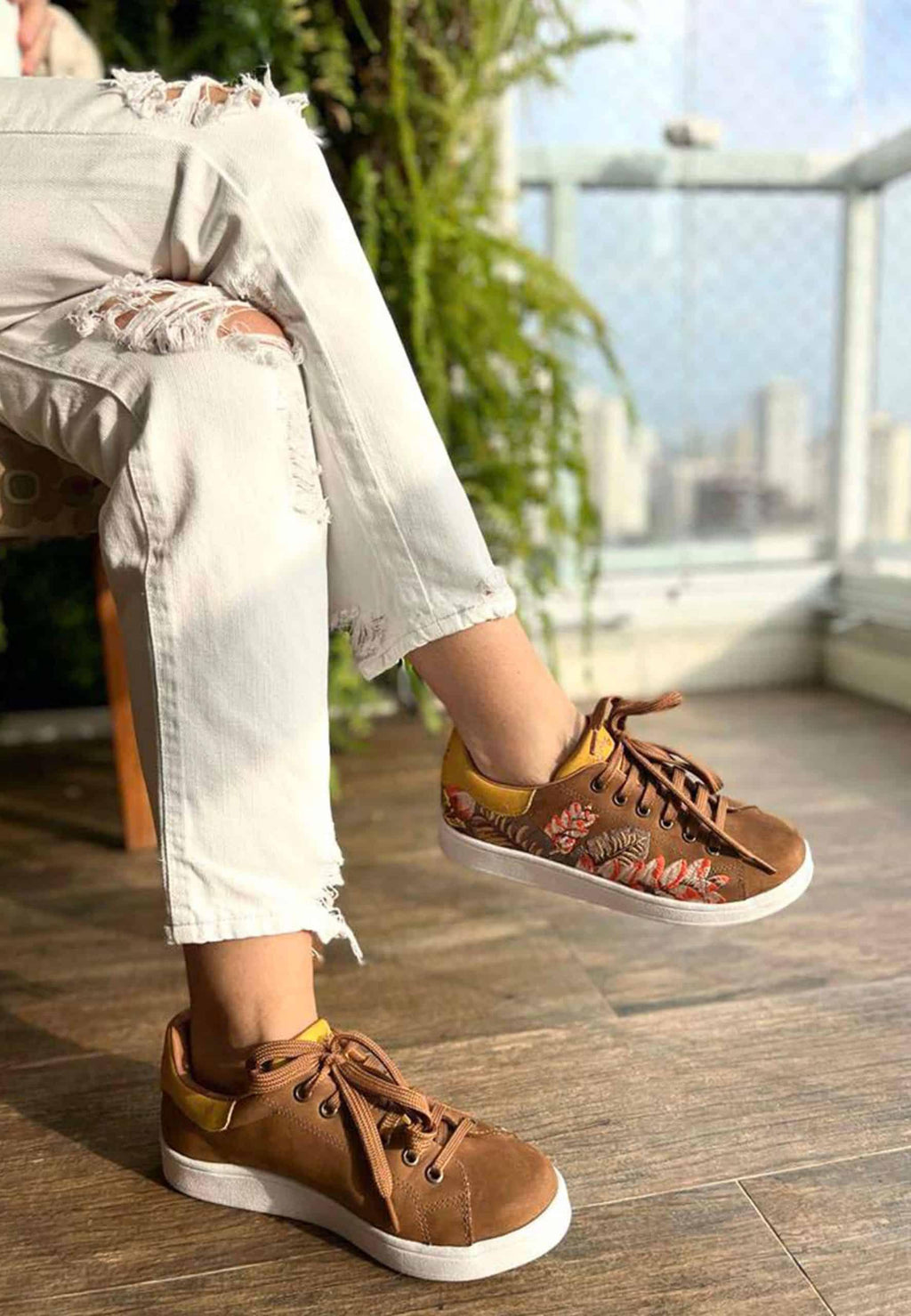 mangara womens suede sneakers with intricate floral embroidery on a soft brown background