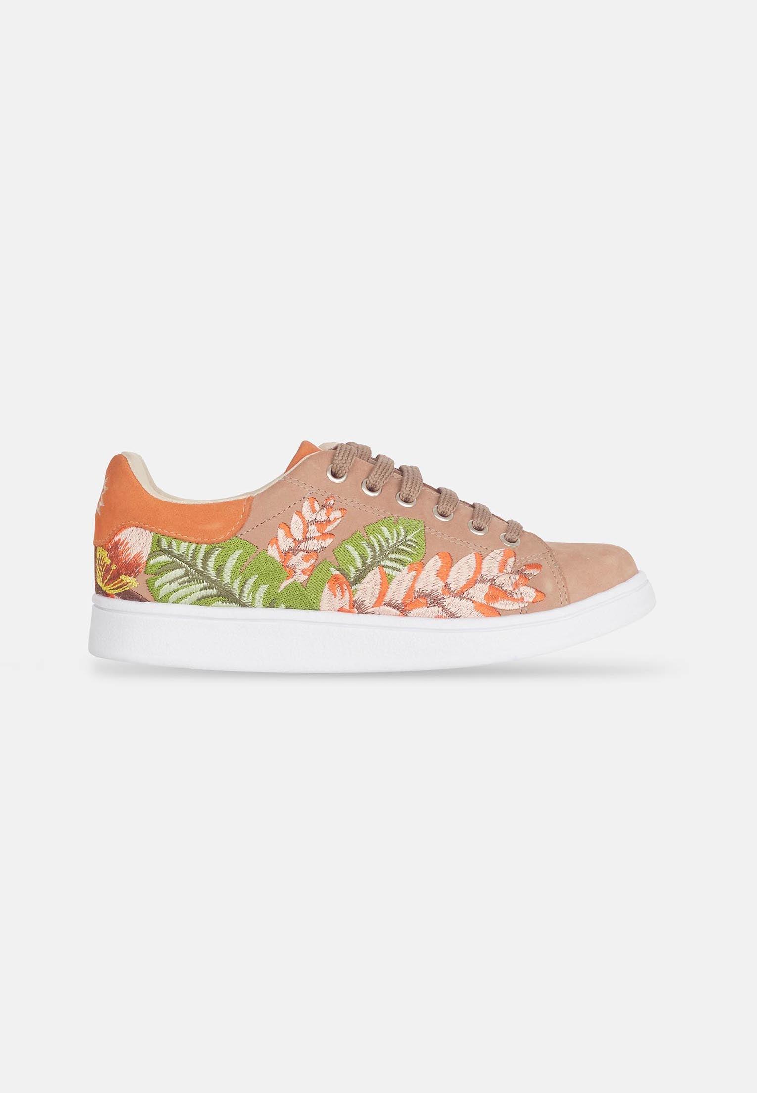 mangara womens suede sneakers with detailed floral embroidery on a soft brown background