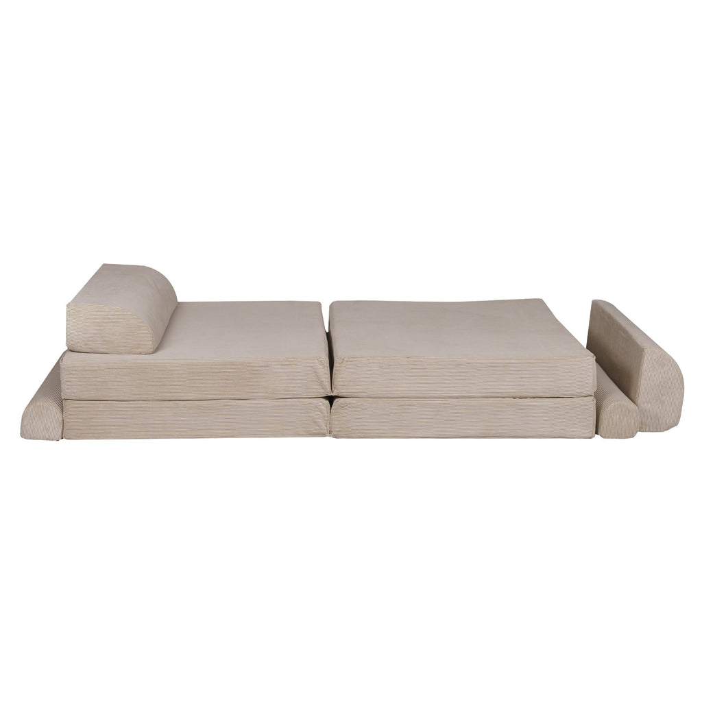 elegant ecru corduroy children's sofa with two poufs in a refined, minimalist interior setting