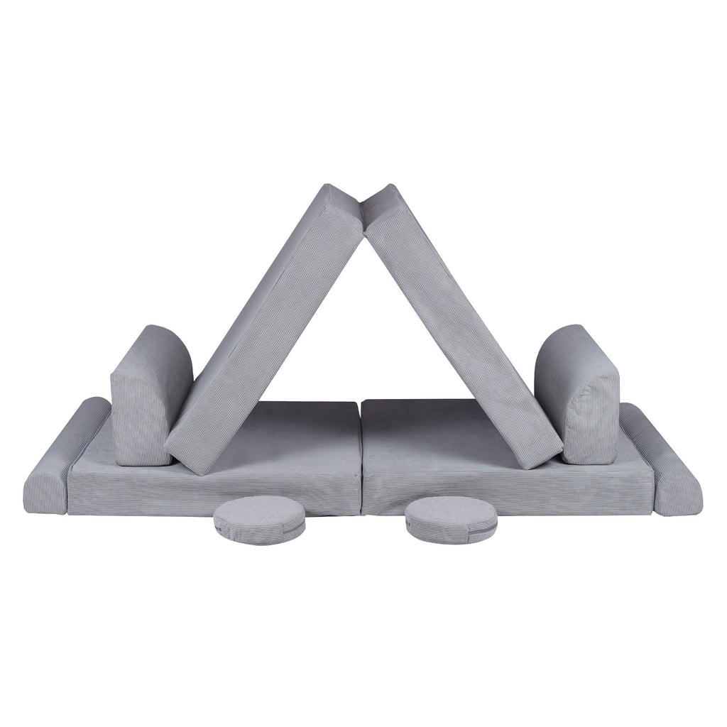 bold gray corduroy kids sofa bed in dramatic studio lighting showcasing its modern, minimalist frame